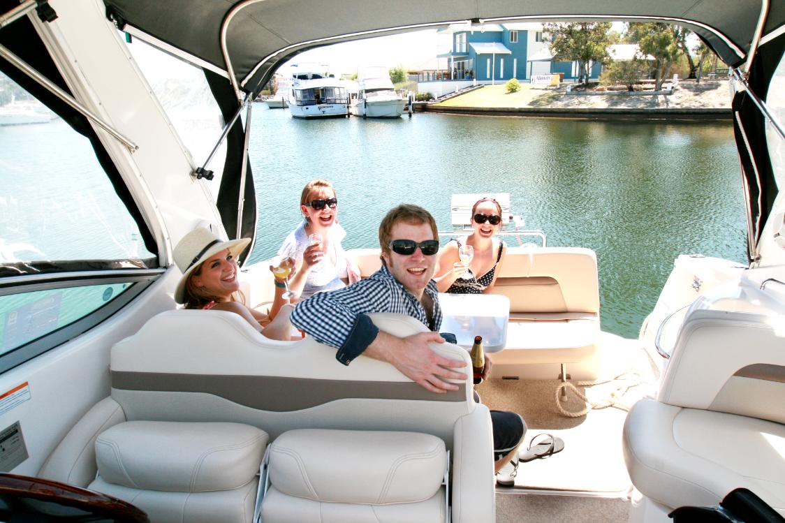 Boat leaving from the private jetty at Captains Cove Waterfront Apartments